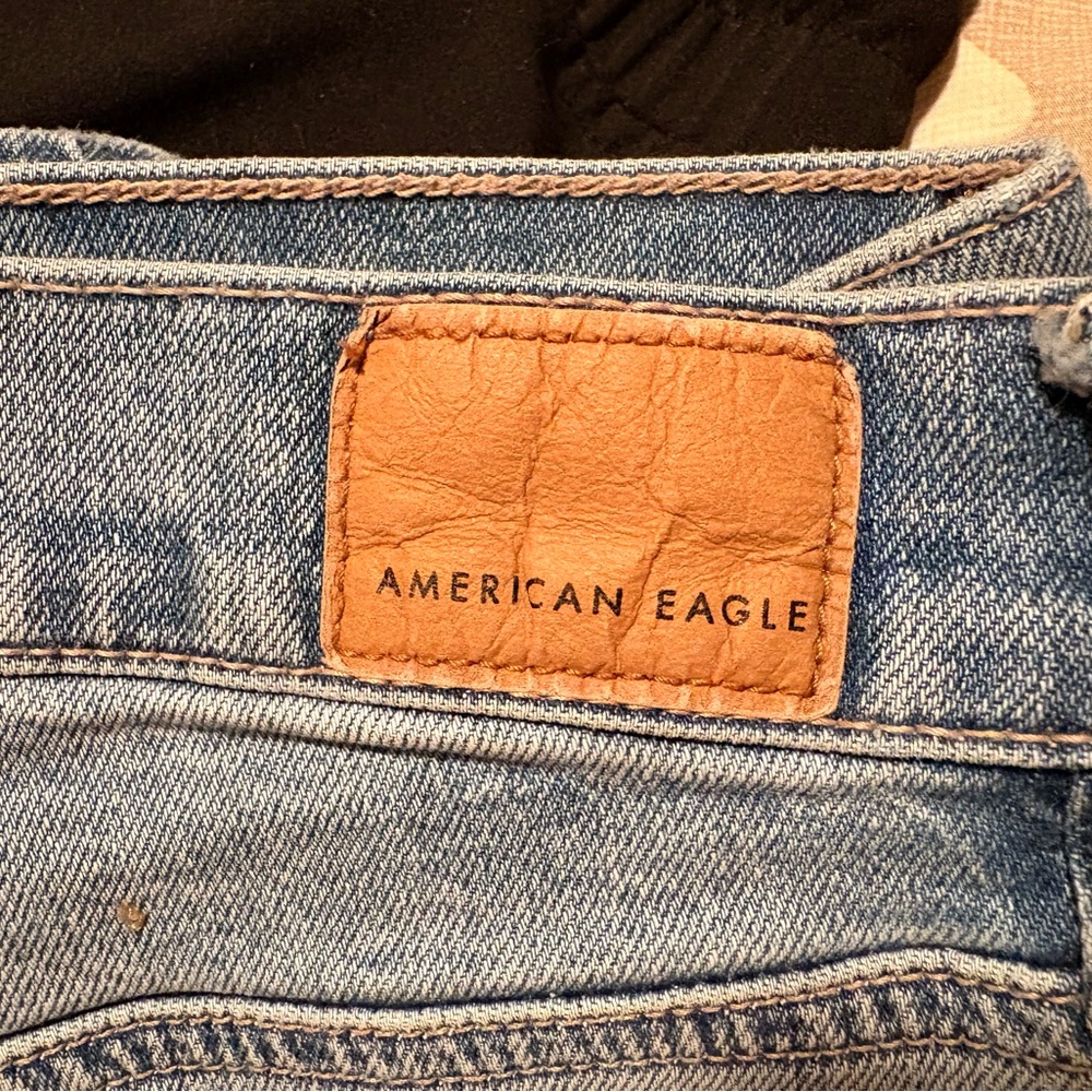 American Eagle Outfitters Light Blue Denim Flare Jeans with Tan Leather Patch